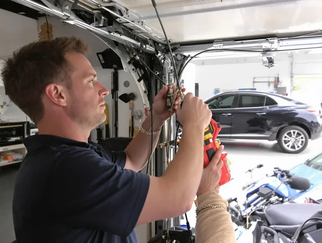 Marblehead Garage Door Repair safety certified technician performing cable replacement in Marblehead